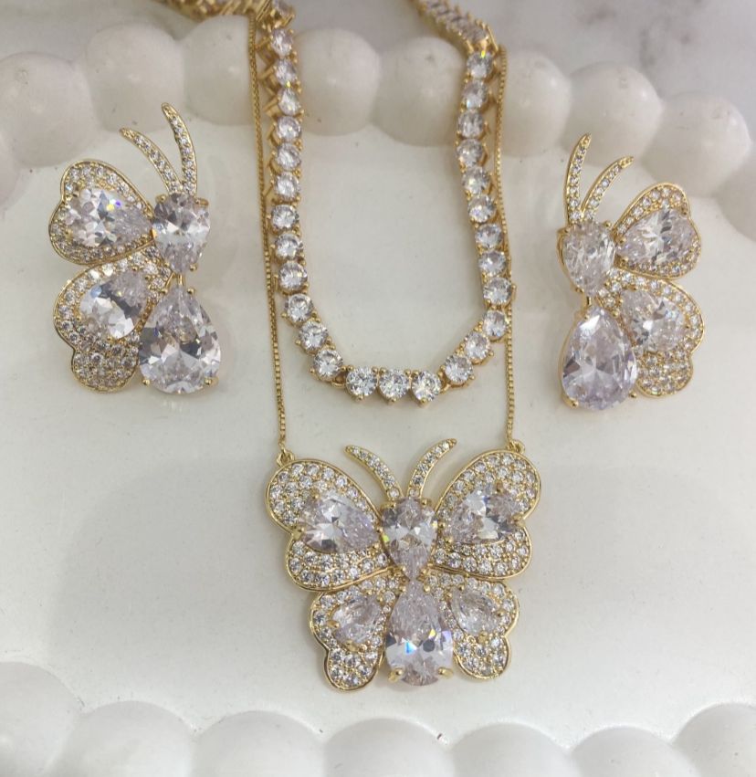 Luxury butterfly jewelry set with sparkling stones.